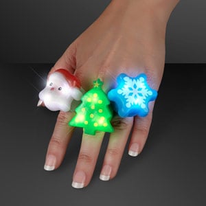 Hand model displaying Assorted LED Light Up Soft Christmas Rings