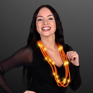 Woman displaying Light Up Orange Beaded Necklace, No-Flash