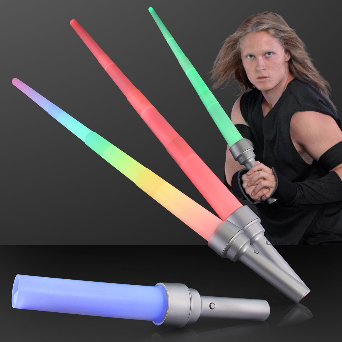 A person in black holds an Expandable Flashing Sword with a glowing blade; above are three more swords in red, green, and rainbow colors, and a blue one lies in front—all set against a dark background.