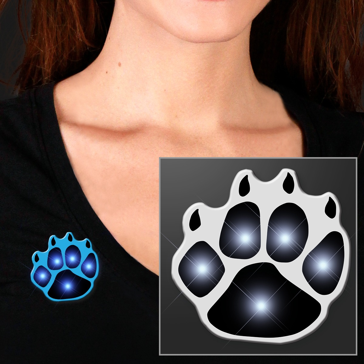 A person wears a black shirt with a Flashing Paw Body Light—a glowing blue and black paw print pin—on the chest; an enlarged version of the paw print design appears in the corner.
