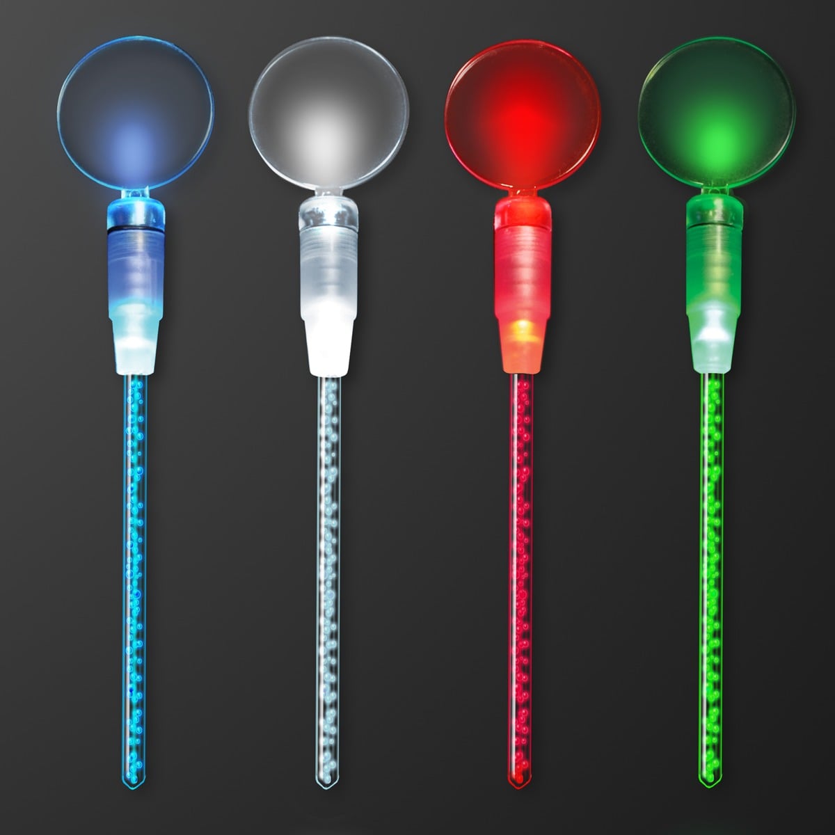 Four Dual LED Swizzle Sticks, Cocktail Party Drink Stirrers with round tops are shown side by side on a dark background, glowing in blue, white, red, and green from left to right.