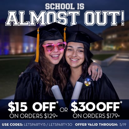 Two girls graduating with light up products