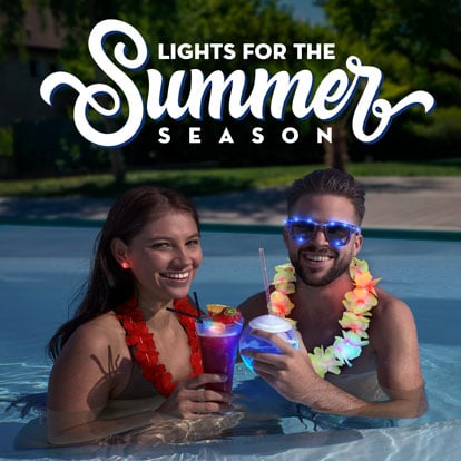 Couple in pool with light up drinkware and wearables